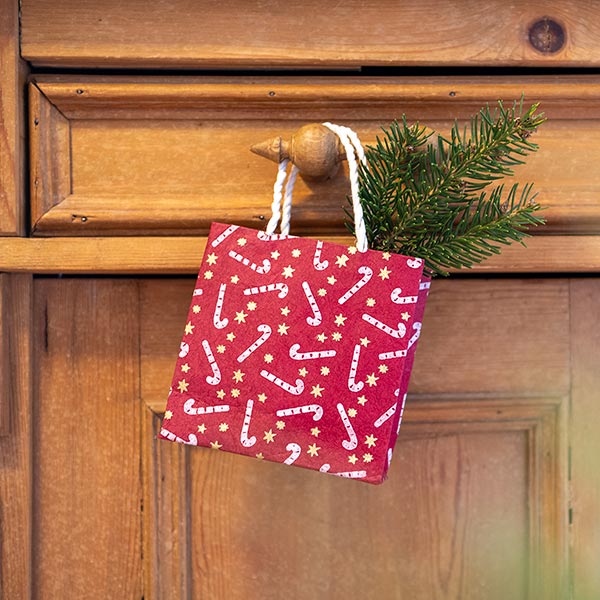 Geschenktüte XS ZUCKERSTANGE, beere-natur, Loktapapier / CONTIGO Fairtrade Onlineshop