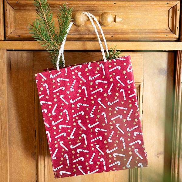 Geschenktüte M ZUCKERSTANGE, beere-natur-gold, Loktapapier / CONTIGO Fairtrade Onlineshop
